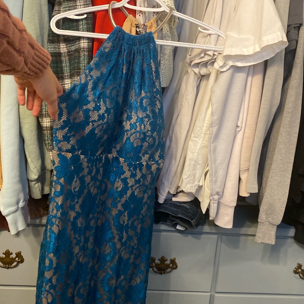 Blue dress, high collar, just above knee length